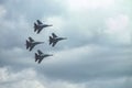 Group of four military aircraft of fighters, jet airplane in the sky make maneuvers Royalty Free Stock Photo