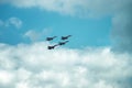 Group of four military aircraft of fighters, jet airplane in the sky make maneuvers Royalty Free Stock Photo