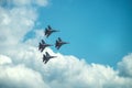 Group of four military aircraft of fighters, jet airplane in the sky make maneuvers Royalty Free Stock Photo