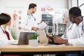 Group of multiethnic doctors having consilium at hospital Royalty Free Stock Photo