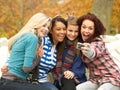 Group Of Four Teenage Girls Taking Picture
