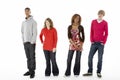 Group Of Four Teenagers In Studio Royalty Free Stock Photo