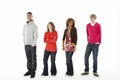 Group Of Four Teenagers In Studio Royalty Free Stock Photo