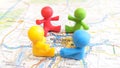 A group of four toy babies sitting in a circle on a map of Munich Royalty Free Stock Photo