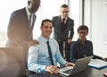 Group of four young business people in office Royalty Free Stock Photo