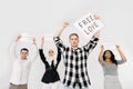 Group of four young multiethnic people raising paper sheets posters for LGBT rights, free love, trust and happiness