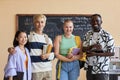 Group of four young successful intercultural students of highschool