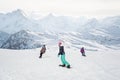 Group of freeride snowboarders rolls and rides snowboards on slope Royalty Free Stock Photo