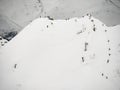Group of freeriders snowboarders skiers rises uphill in the Caucasus in the rose khutor Royalty Free Stock Photo