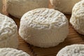 Group of French Crottin de chevre on wicker surface close up Royalty Free Stock Photo