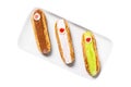 Group of french dessert Eclair on white background. Royalty Free Stock Photo