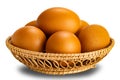 Group of fresh chicken eggs in banboo basket isolated on white background