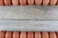 Group of fresh chicken eggs from farm on vintage wooden table background. Advertising image food concept with free space Royalty Free Stock Photo