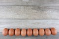 Group of fresh chicken eggs from farm on vintage wooden table background. Advertising image food concept with free space Royalty Free Stock Photo