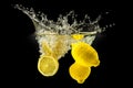 Group of fresh fruits falling in water with splash on black background Royalty Free Stock Photo