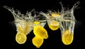 Group of fresh fruits falling in water with splash on black background Royalty Free Stock Photo