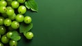 Group of Fresh Green Gooseberry Fruits On Green Background with Copy Space Selective Focus Royalty Free Stock Photo