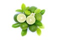 Fresh lime slice and green leaf isolated on white background