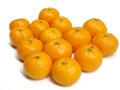 A group of fresh mandarin oranges arranged on a clean white background. Royalty Free Stock Photo