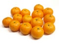 A group of fresh mandarin oranges arranged on a clean white background. Royalty Free Stock Photo