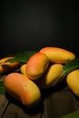 Group fresh mango with black ground.