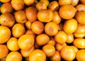 Group of fresh organic orange fruit sell in market thailand. vitamin C from natural vegan food. circle pattern shape in fullframe.