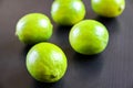 Group of fresh organic limes on a black background Royalty Free Stock Photo