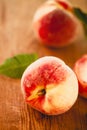 Group of fresh peaches on wood background Royalty Free Stock Photo