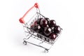 Group of fresh red cherries in a small shopping cart Royalty Free Stock Photo