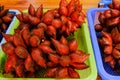 group of fresh red salak or salacca zalacca fruit in basket for sell in traditional market. sweet and sour tasty and fragrance. sh Royalty Free Stock Photo