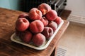 Group of fresh ripe peaches prepared on a kitchen table Royalty Free Stock Photo