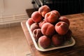 Group of fresh ripe peaches prepared on a kitchen table Royalty Free Stock Photo