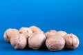 Group of wallnuts is on a blue background, healthy food concept