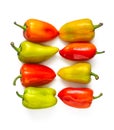 Group of fresh yellow-green and red peppers on a white background Royalty Free Stock Photo