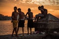 Group of friend jump into sea from wall in Havana, Cuba