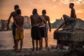 Group of friend jump into sea from wall in Havana, Cuba