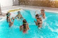 Group of friend play together in the swimming pool Royalty Free Stock Photo