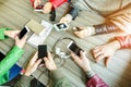 Group of friends are addicted using mobile phone devices - Upper point of view people hands using smart cell phones together - Royalty Free Stock Photo