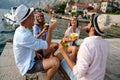 Group of friends at beach drinking cocktails having fun on summer vacation. People travel concept Royalty Free Stock Photo