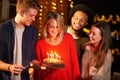 Group Of Friends Celebrating Birthday At Outdoor Party Royalty Free Stock Photo