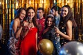 Group of friends celebrating with fireworks and glasses enjoying Christmas party Royalty Free Stock Photo