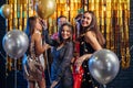 Group of friends celebrating with fireworks and glasses enjoying Christmas party Royalty Free Stock Photo