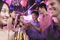 Group of friends celebrating, toasting with champagne, nightclub in Beijing Royalty Free Stock Photo