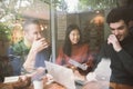 Group of friends chatting and using laptop Royalty Free Stock Photo