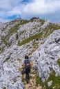 Group of friends climbing to the top of Mount Aizkorri ascent