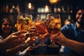 Group of friends clinking glasses with drinks at bar counter, close up, Close up of group of people clinking glasses with Royalty Free Stock Photo