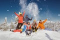 Group of friends in colorful clothes at ski resort Royalty Free Stock Photo