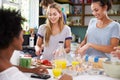 Group Of Friends Cooking Breakfast In Kitchen Together