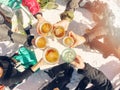group of friends drinking beer on break at ski