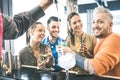 Group of friends drinking cocktails and talking at restaurant - Royalty Free Stock Photo